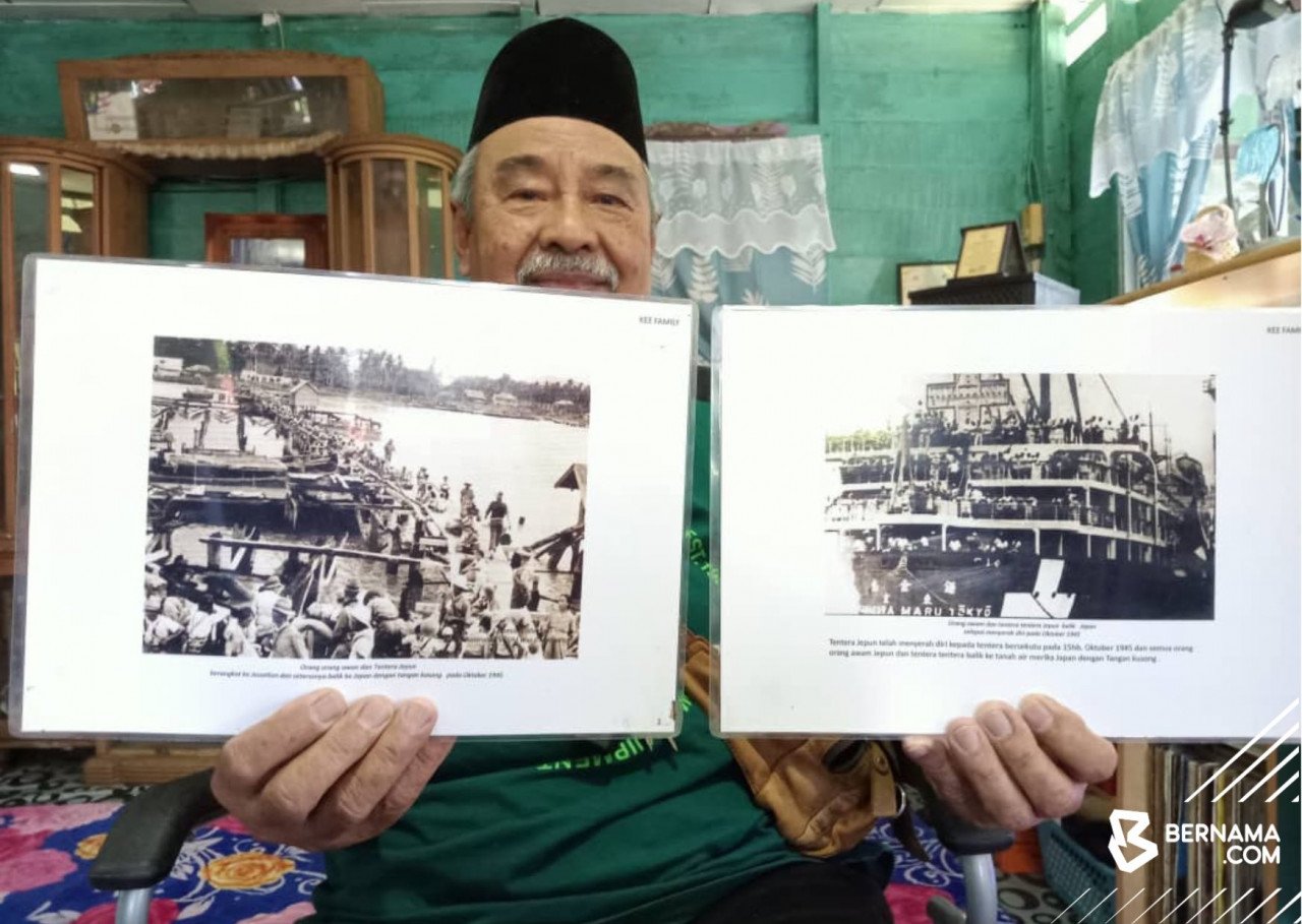 Pakcik Om menunjukkan foto sejarah kependudukan Jepun di Sabah yang disimpan dalam koleksinya. - gambar BERNAMA
